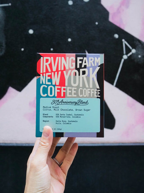 30th Anniversary Blend box held up in front of a New York mural