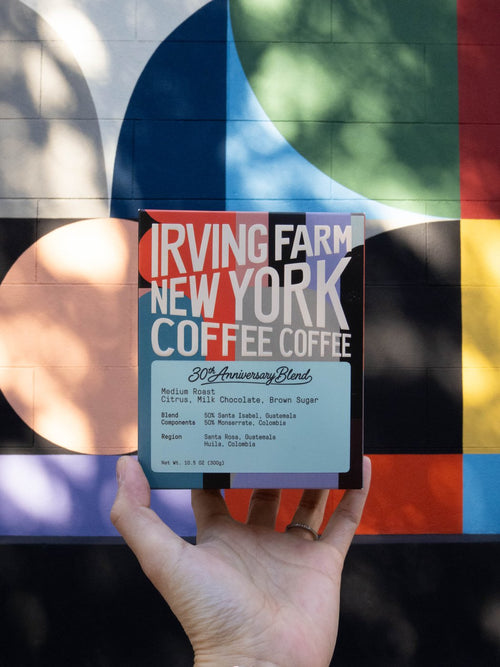 30th Anniversary Blend box held up in front of a New York mural