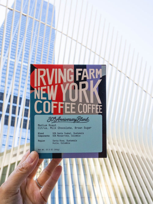 30th Anniversary Blend box held up in front of a New York mural